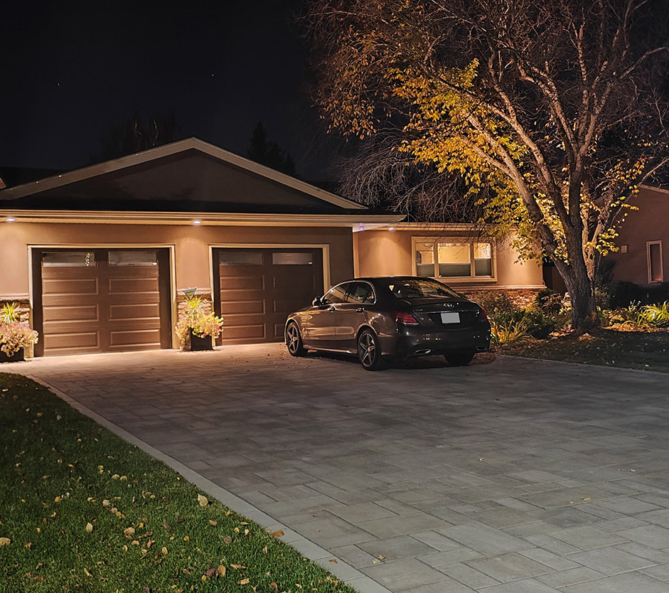 Paver driveway with landscape lighting